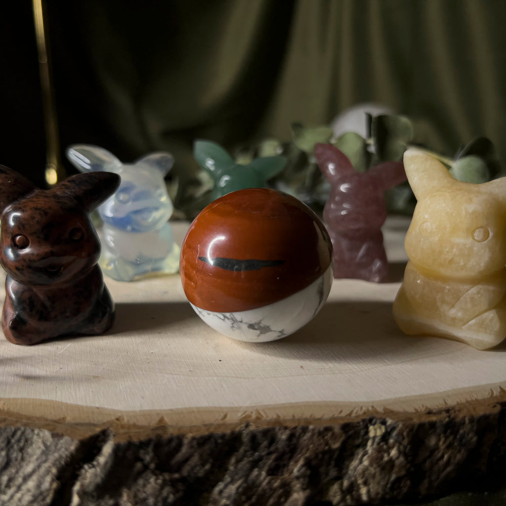 All pikachus with a howlite and red jasper pokeball.