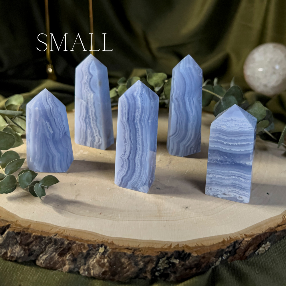 Blue crystal towers with white lace like banding, small size.