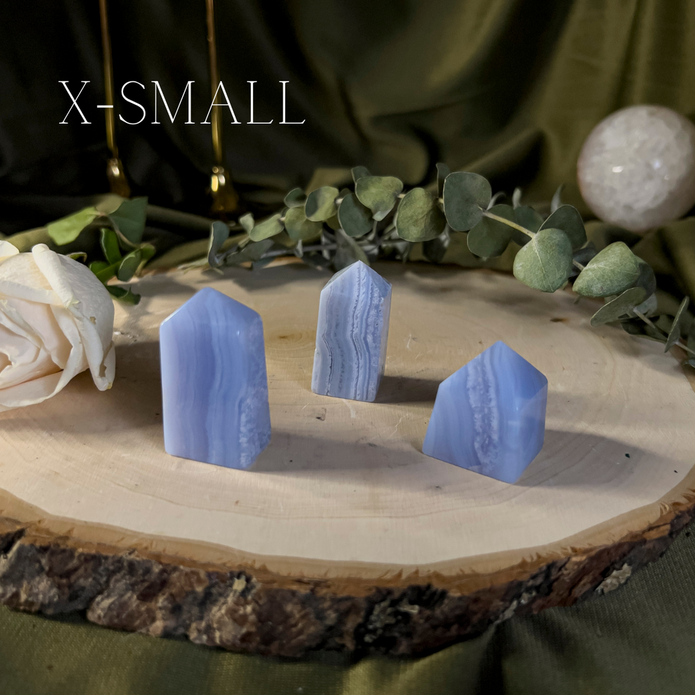 Blue crystal towers with white lace like banding, extra small size.